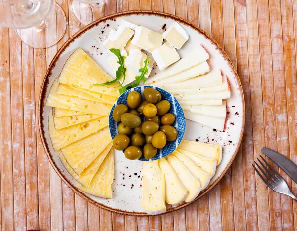 Assorted Sliced Cheeses Served Green Olives Platter — Stock Photo, Image