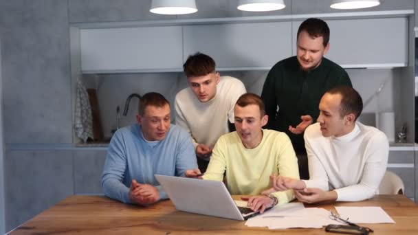 Group Men Engaged Serious Discussion Paperwork Laptop Accompanied Casual Drinks — Stock Video