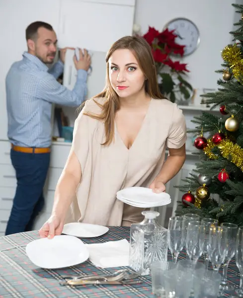 Positive Couple Cleaning House Serving Table Christmas Celebration Stock Image
