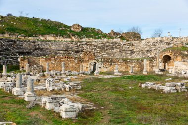 View of ruins of Theater Baths on background of ancient Odeon in Greek city of Aphrodisias in historic Caria cultural region, Turkey clipart