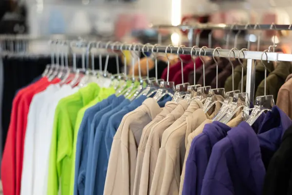 Different Hoodies Hanging Stand Big Clothing Store Large Assortment — Stock Photo, Image