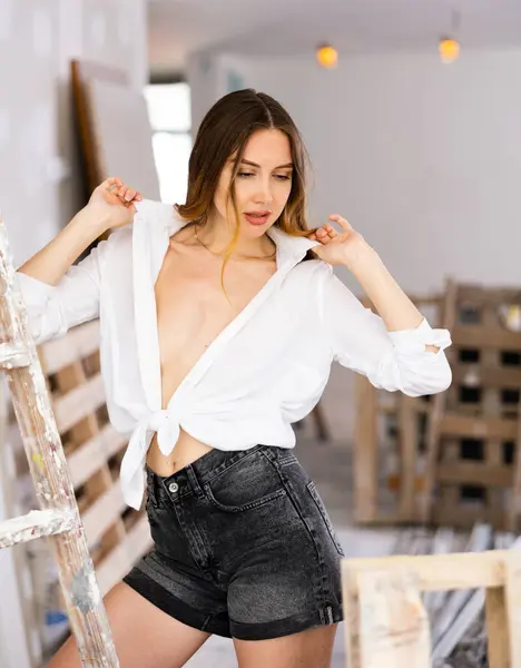 Sexy Young Woman White Blouse Short Shorts Poses Playfully Renovated — Stockfoto