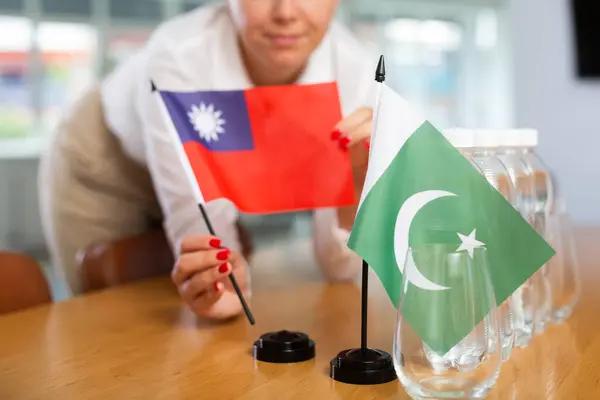 Young Woman Business Clothes Puts Flags Taiwan Pakistan Negotiating Table — Stock fotografie