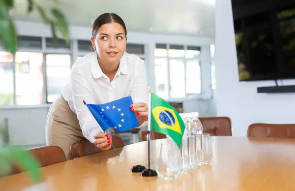 Positive Young Woman Putting Little Flag European Union Table Next Fotos De Stock Sin Royalties Gratis
