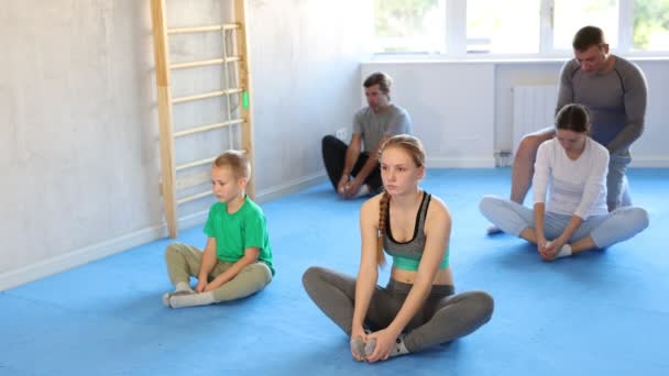 Cheerful Family Parents Children Athletes Training Martial Arts Performs Stretching — Stock Video