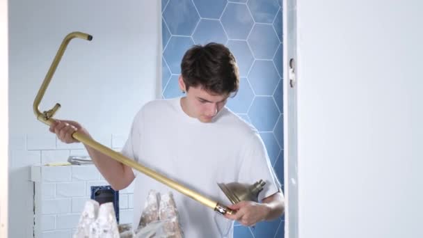 Interested Young Guy Preparing New Shower Set Installation Building Construction — Stock Video
