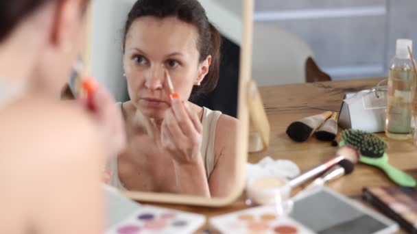 Serene Confident Adult Woman Applying Eye Concealer Carefully Well Lit — Stock Video
