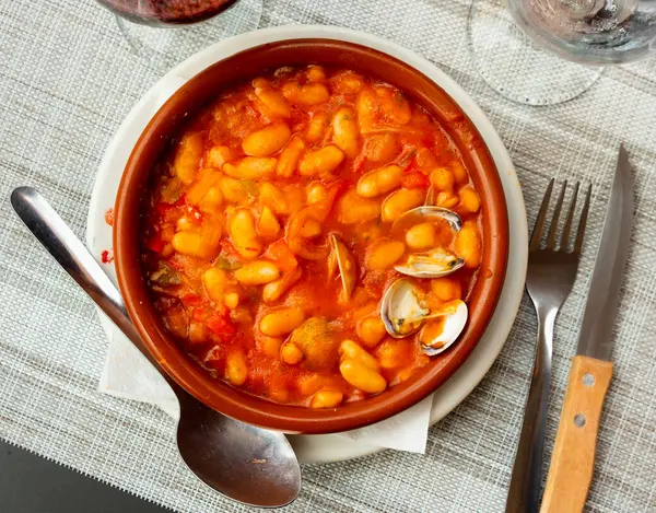 Appetizing clam and bean stew served in a plate