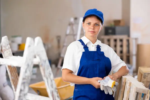 Portrait Positive Builder Woman Blue Overalls Next Stepladder Imagen De Stock
