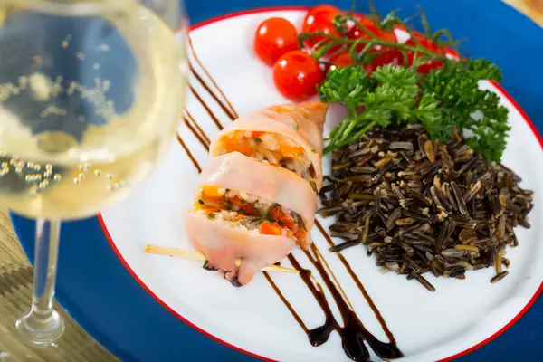 stock image Stuffed squid with wild rice and cherry tomato is tasty dish in the kitchen.