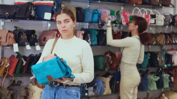Inspection Stores Assortment Girl Chooses Small Lady Handbag Closely Examines — Stock Video