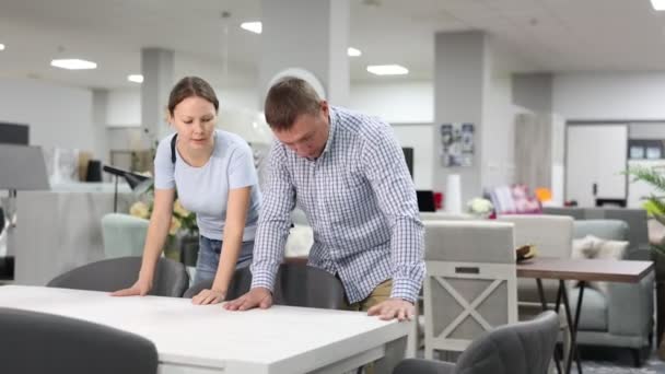 Spouses Choose Dining Table Desk Furniture Store Showroom Husband Runs — Stock Video