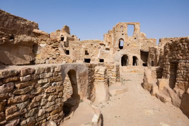 Ruins of ghorfas in ancient Ksar Beni Barka Berber settlement, Tataouine, Tunisia clipart