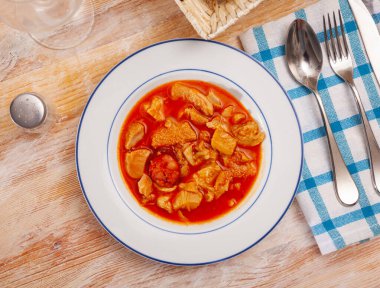 Image of soup from tasty boiled beef tripe with chorizo at plate clipart