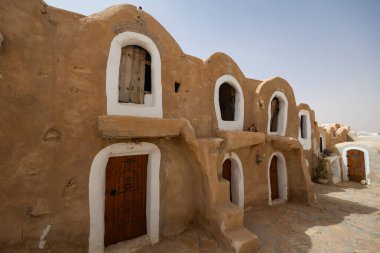 Ghorfa storage graneries of the traditional Berber mud brick fortified Ksar of Hedada or Hadada, near Tetouin, Tunisia clipart