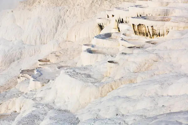 stock image Amazing landscape of Pamukkale thermal springs with cascade of white calcite terraced baths, Turkey