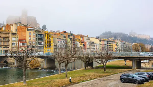 stock image View of bridge over Segre River in Catalonia - town of Balaguer. Foggy morning in ancient European city