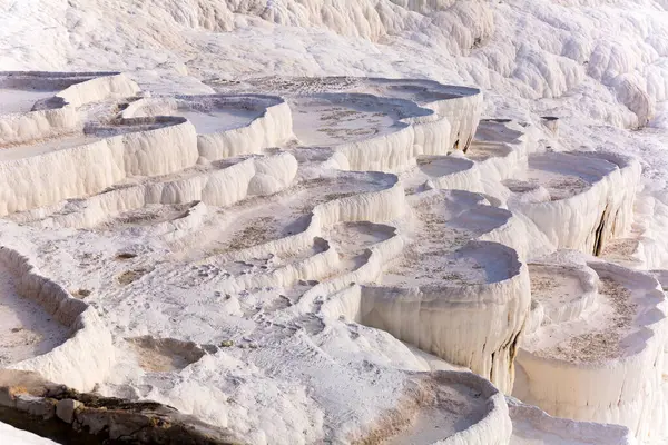 stock image Lacy white travertine formations at hot springs of cotton castle of Pamukkale on sunny day, Turkey