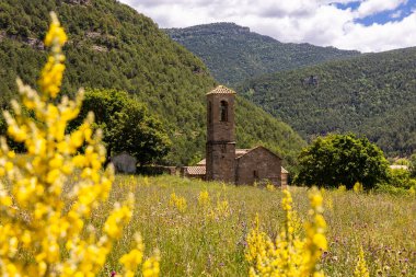 View of the medieval church in the village of Iglesia. Santa Eulalia of the Houses of Posada IX-X centuries. Spain clipart