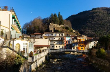 View on bridge in the old town of Camprodon in Pyrenees at winter, Girona province, Spain clipart