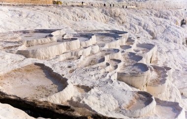 Picturesque view of natural white travertine terraces with hot springs in Pamukkale in Turkey clipart