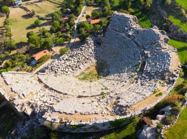 Scenic aerial view of remains of antique Roman theater of ancient city of Selge in Altinkaya village, Antalya province on sunny spring day, Turkey clipart