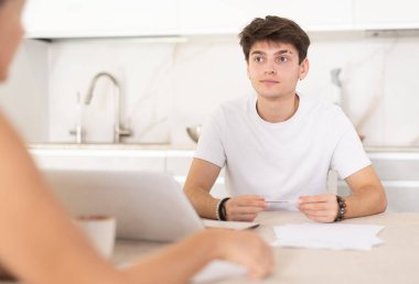 Manager guy convinces female client to sign contract for purchase of real estate. Obtaining of apartments, housing, apartments in sales office clipart