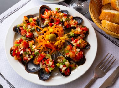 Image of delicious mussels served with vinaigrette from vegetables clipart