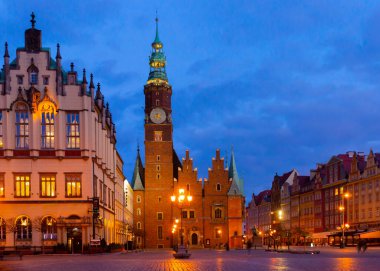 Gothic building of Old Town Hall in central square of Polish city of Wroclaw in night lights clipart