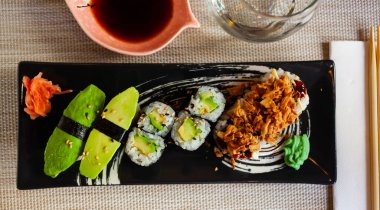 Combined sushi - maki, california, nigiri closeup. Japanese cuisine clipart