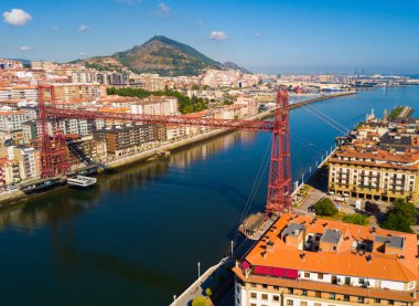 Aerial view of Vizcaya bridge over the river and cityscape at Portugalete, Spain clipart