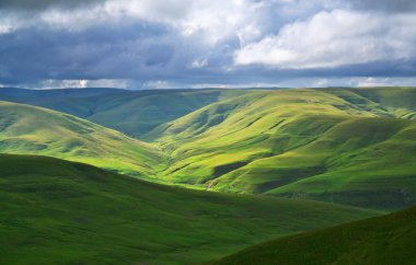 Green mountain hills during the sunset. Nature landscape.