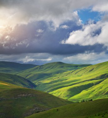Green mountain hills during the sunset. Nature landscape.