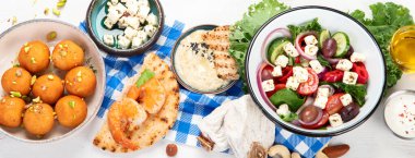 Greek cuisine dishes on neutral background. Traditional food concept. Top view, panorama