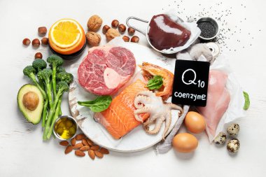 Composition with food contains coenzyme Q10, antioxidant, produce energy to cell, products against free radicals, and supports body as it ages, immune system, keeping body strong and healthy. Top view