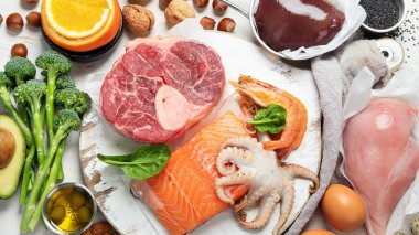 Composition with food contains coenzyme Q10, antioxidant, produce energy to cell, products against free radicals, and supports body as it ages, immune system, keeping body strong and healthy. Top view