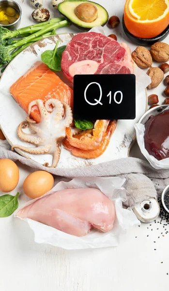 Composition with food contains coenzyme Q10, antioxidant, produce energy to cell, products against free radicals, and supports body as it ages, immune system, keeping body strong and healthy. Top view