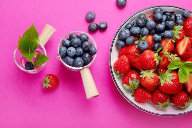 Strawberries on color background. Concept of organic food. Top view, copy space