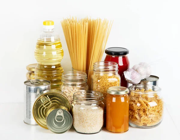 Food supplies. Crisis food stock. Different glass jars with grains, pasta, oil, nut, canned food