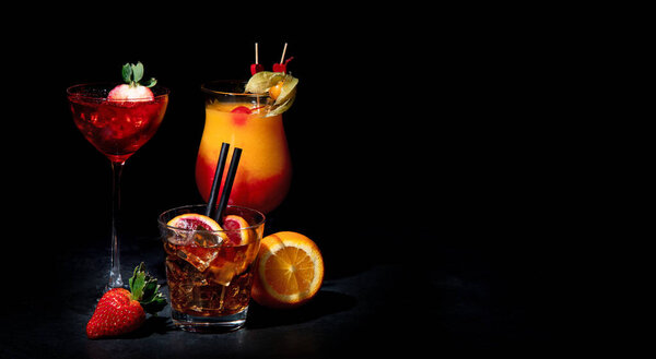 Set of various colorful cocktails on black background. Classic long drink cocktails menu concept. Copy, space