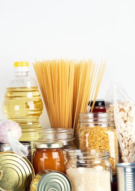 Food supplies. Crisis food stock. Different glass jars with grains, pasta, oil, nut, canned food