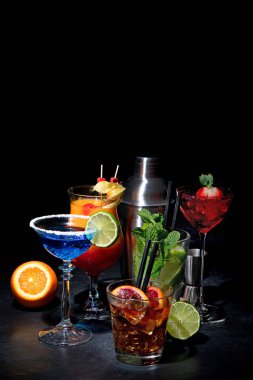 Set of various colorful cocktails on black background. Classic long drink cocktails menu concept. Copy, space