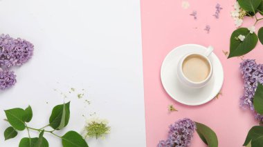Composition with cup of coffee on color background. Spring natural background. Top view, flat lay, copy space