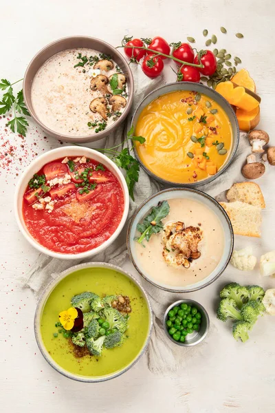 stock image Variety of vegetables cream soups in small pots. Top view. Concept of healthy eating or vegetarian food.