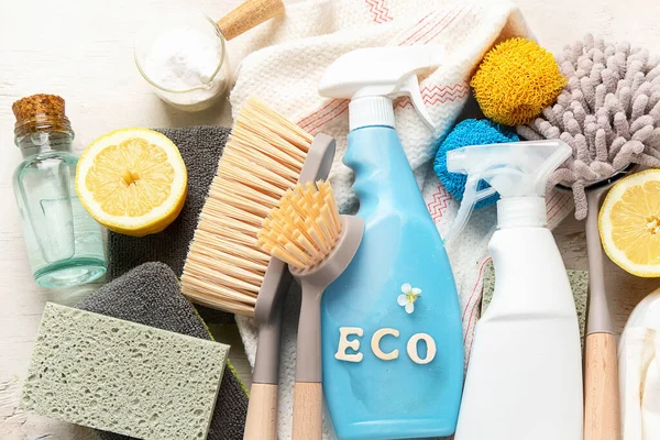 Eco brushes and cleaning products on light background.  Eco Cleaner concept. Top view