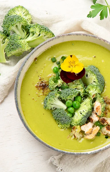 Green soup. Broccoli cream soup. Healthy vegan dish. Top view,  copy space