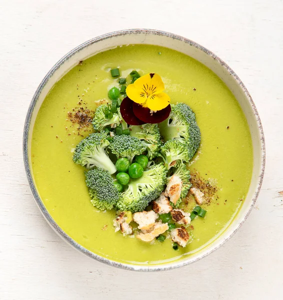 Green soup. Broccoli cream soup. Healthy vegan dish. Top view,  copy space