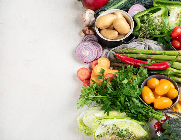 Healthy food clean eating selection: fruit, vegetable, seeds, superfood, cereal, leaf vegetable on a white background. Top view.