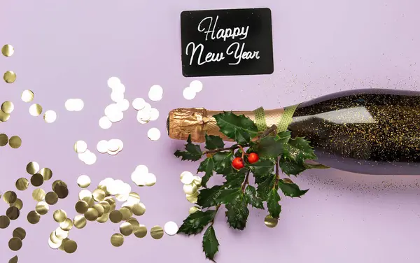 Champagne bottle with confetti on violet background. Christmas, birthday or wedding concept. Flat lay.