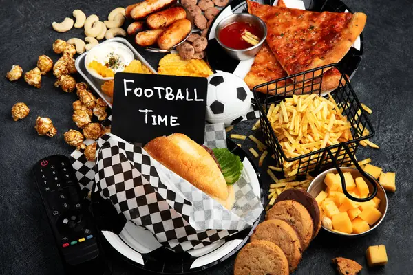 Saturated Fats Football Time Remote Control Snacks Chips Popcorn Cookies — Stock Photo, Image